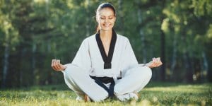 Martial Arts Lessons for Adults in Rosemead CA - Happy Woman Meditated Sitting Background